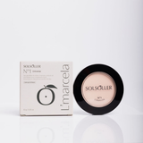 Baby pink setting powder color-correcting macro shot