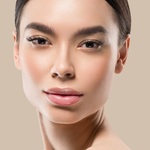 Model with flawless complexion using Teint Naturelle Foundation. Natural, breathable coverage for everyday wear.