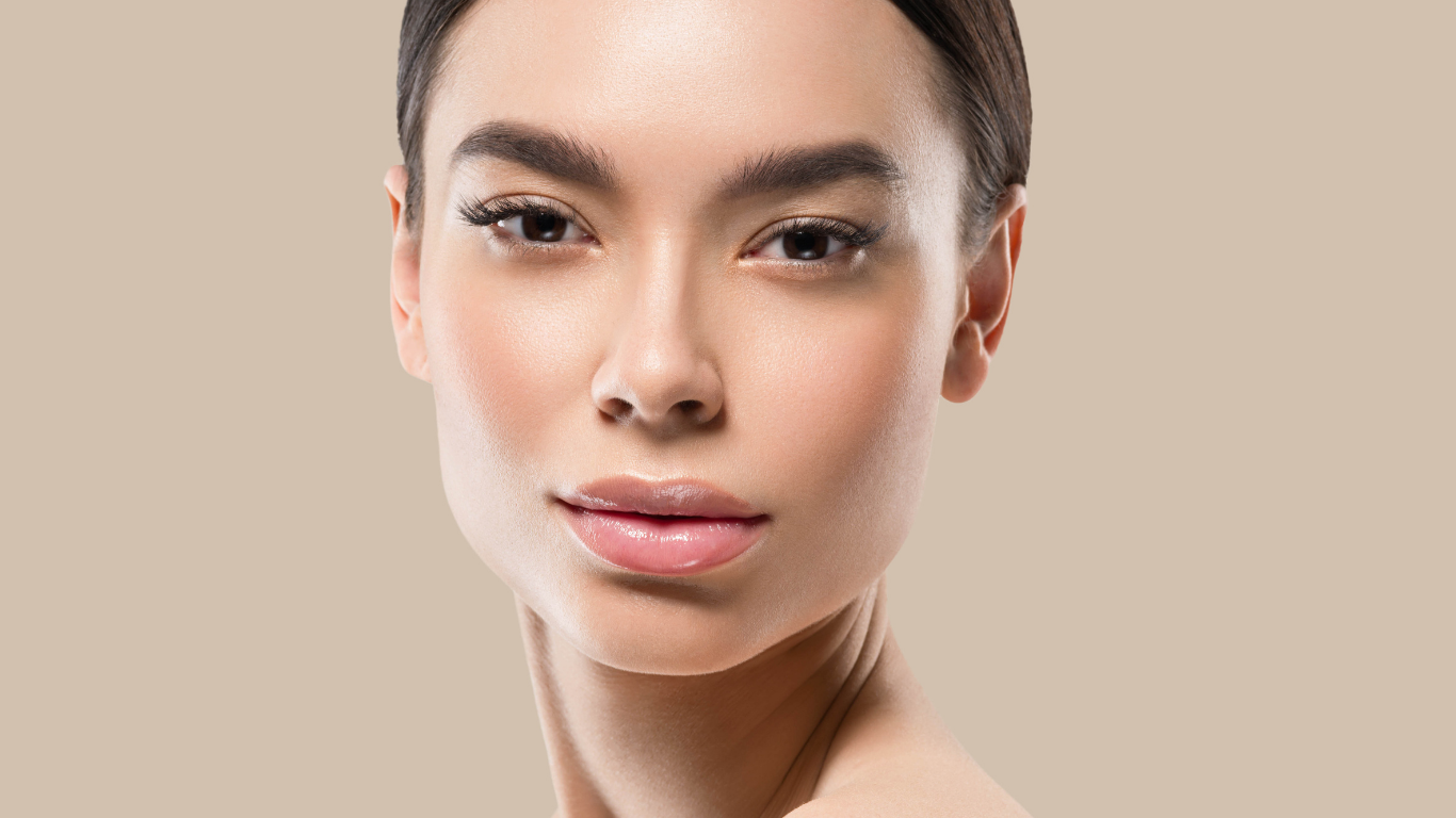 Model with flawless complexion using Teint Naturelle Foundation. Natural, breathable coverage for everyday wear.