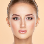 Model with flawless complexion wearing Teint Naturelle Foundation. Radiant, lightweight base enhances natural beauty.