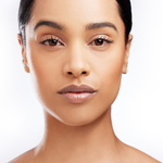 Model with flawless finish using Teint Naturelle Foundation. Hydrating formula for radiant, even-toned skin.