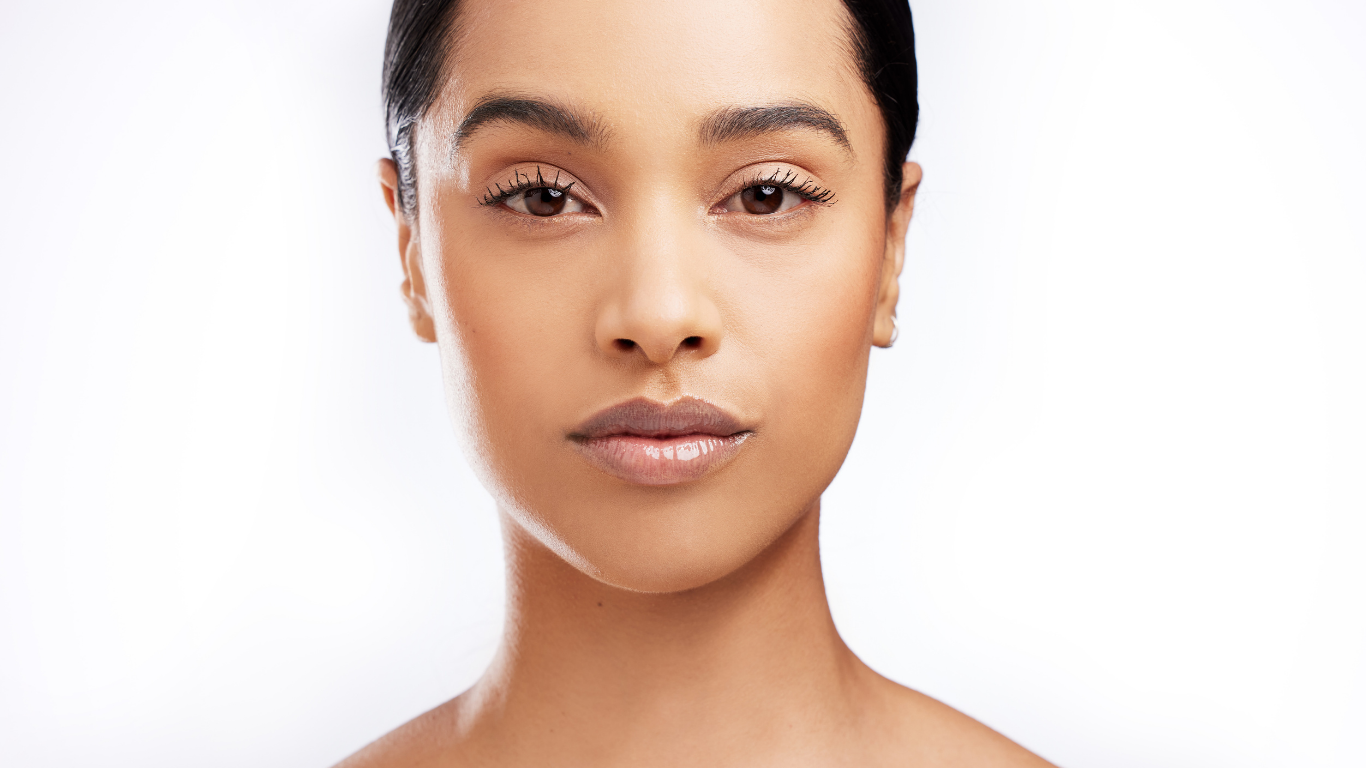 Model with flawless finish using Teint Naturelle Foundation. Hydrating formula for radiant, even-toned skin.