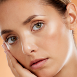 Model with subtle glow wearing Teint Naturelle Foundation. Ideal for a soft, natural makeup finish.