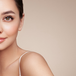 Model with luminous skin tone wearing Teint Naturelle Foundation. Enhances natural glow with lightweight coverage.