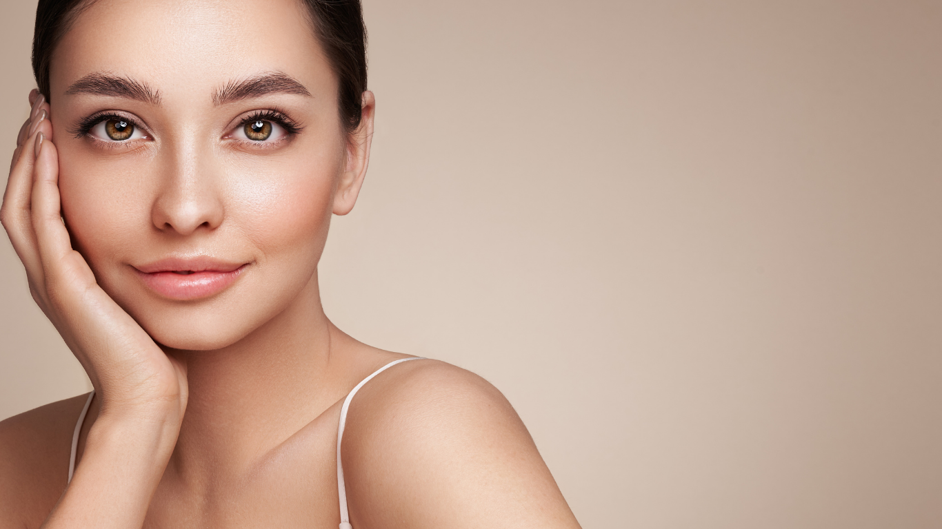 Model with luminous skin tone wearing Teint Naturelle Foundation. Enhances natural glow with lightweight coverage.