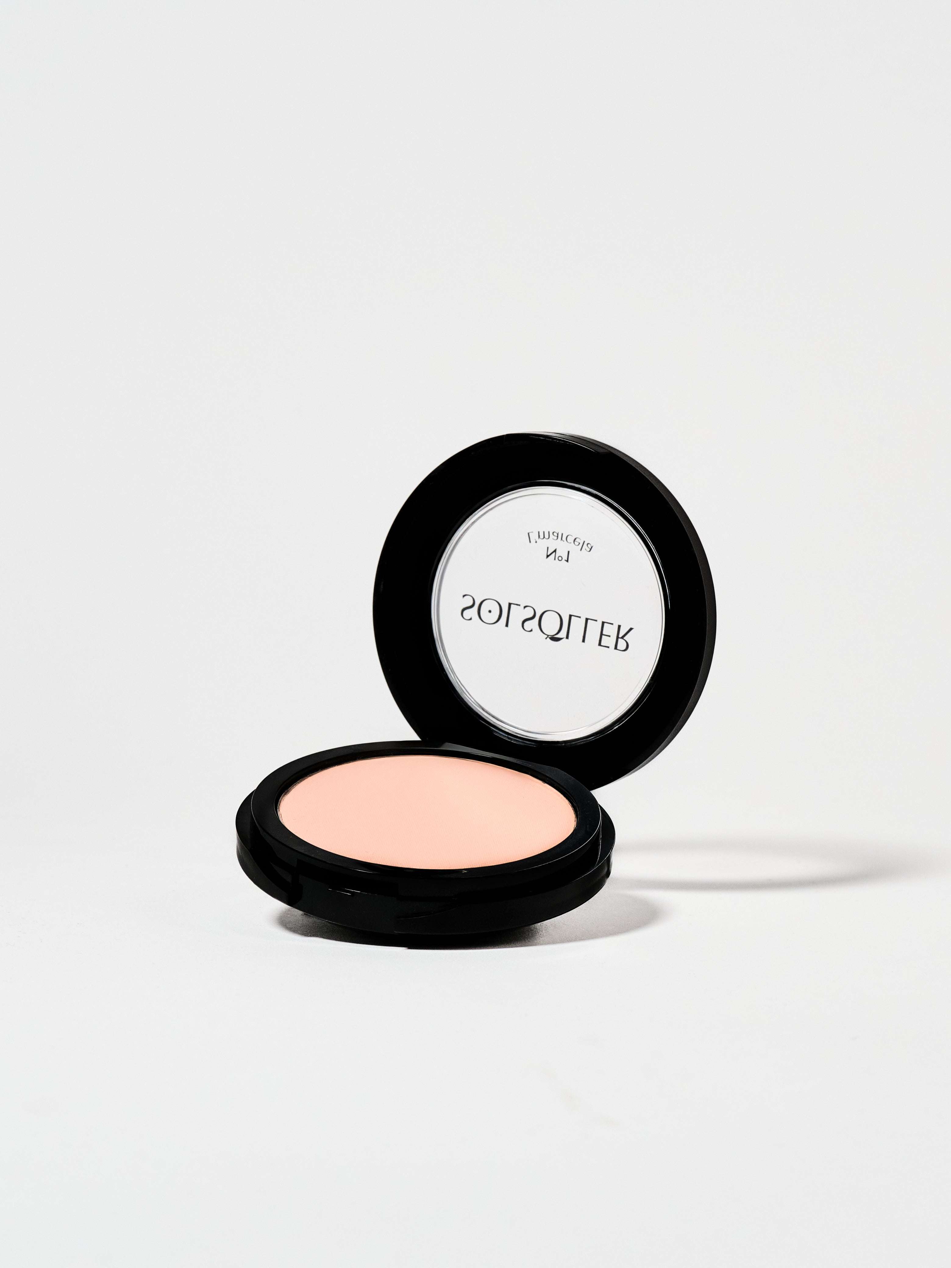 Open compact of L'marcela: Long-Lasting and Pore-Friendly Baby Pink Setting Powder revealing the soft pink pressed powder for smooth coverage.