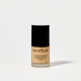 Back of Teint Naturelle Foundation bottle in Satin Almond. Features product message and shade details.