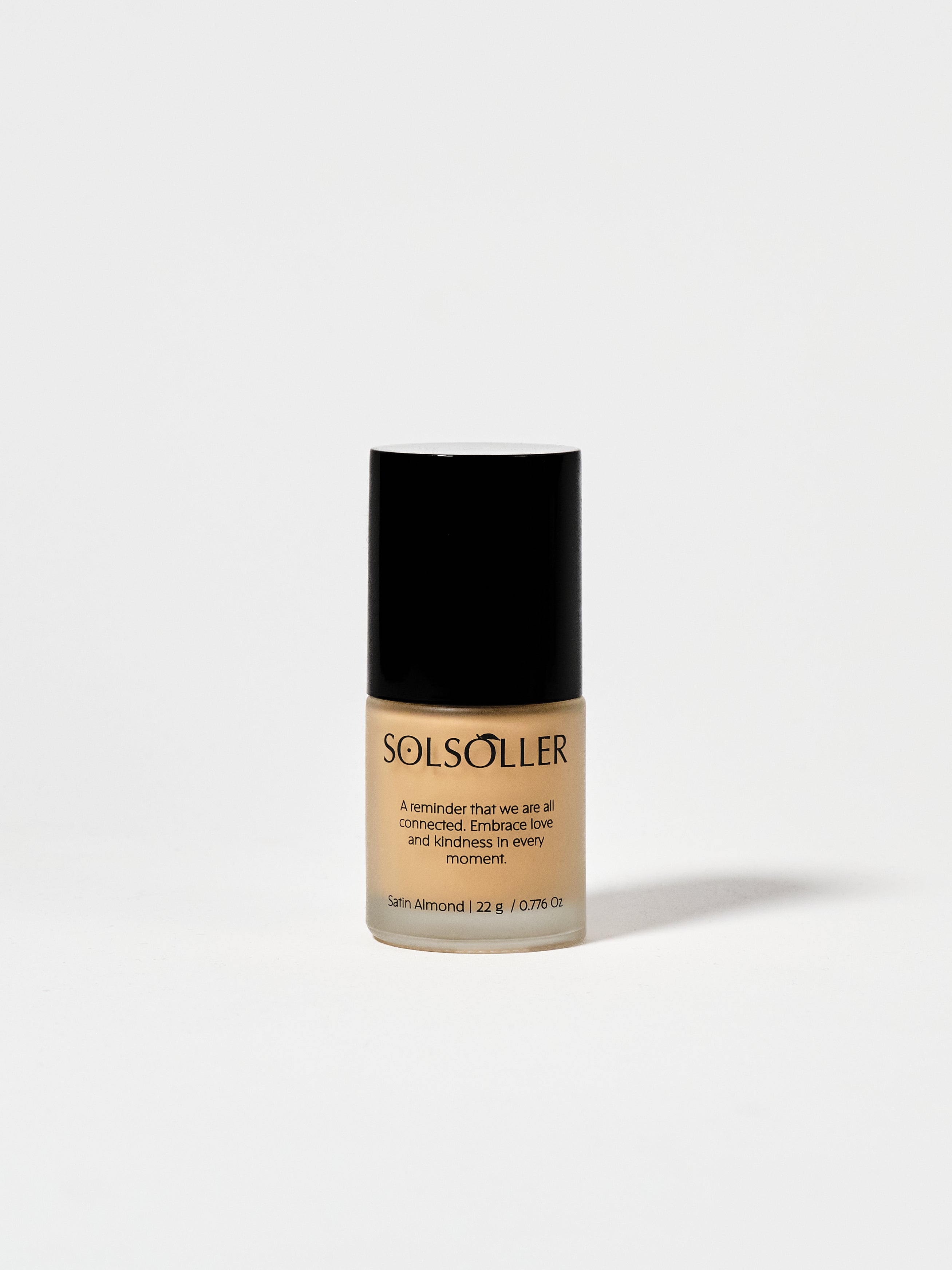 Back of Teint Naturelle Foundation bottle in Satin Almond. Features product message and shade details.
