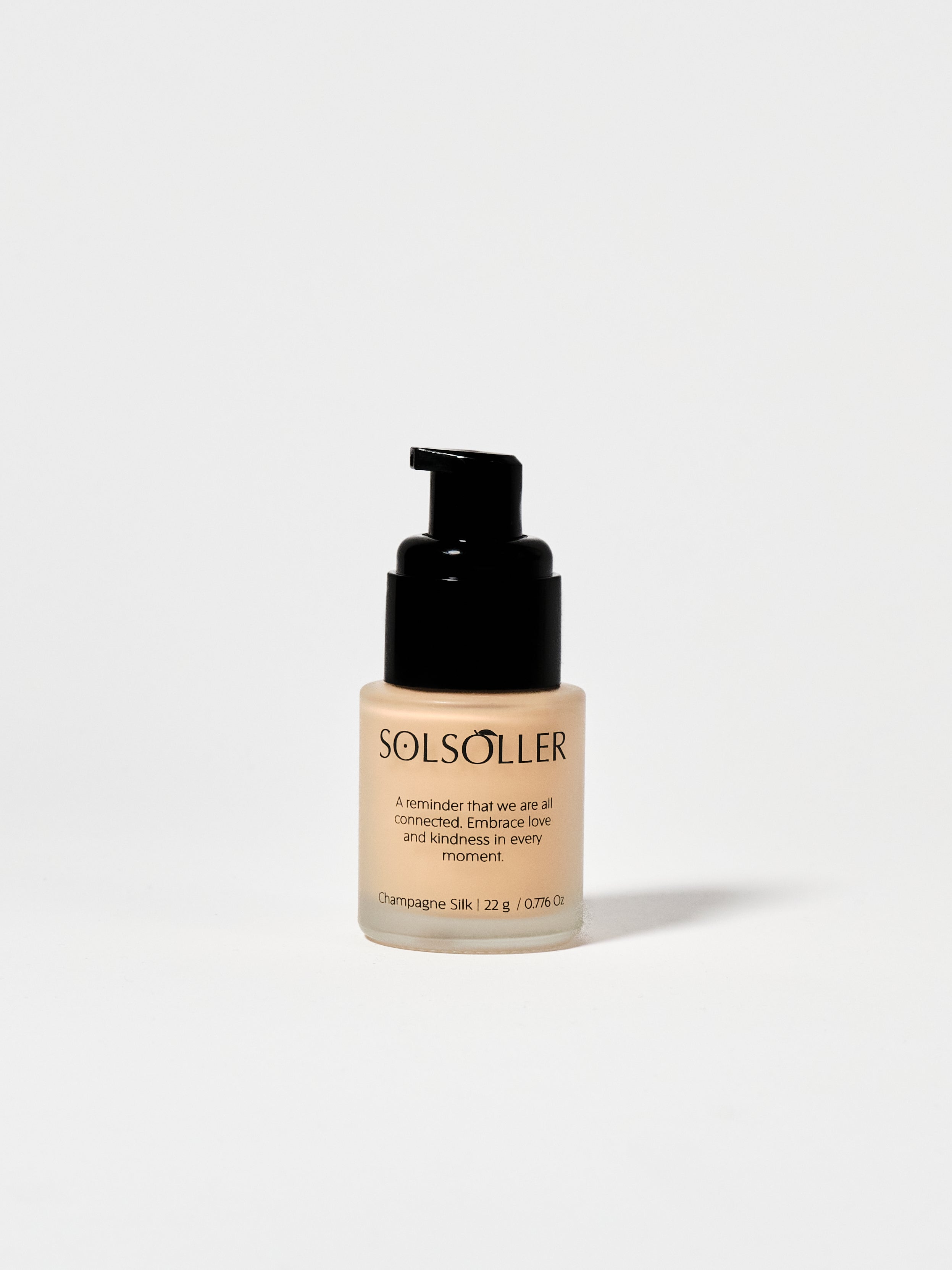 Back of Teint Naturelle Foundation bottle in Champagne Silk. Features inspirational quote and product details.