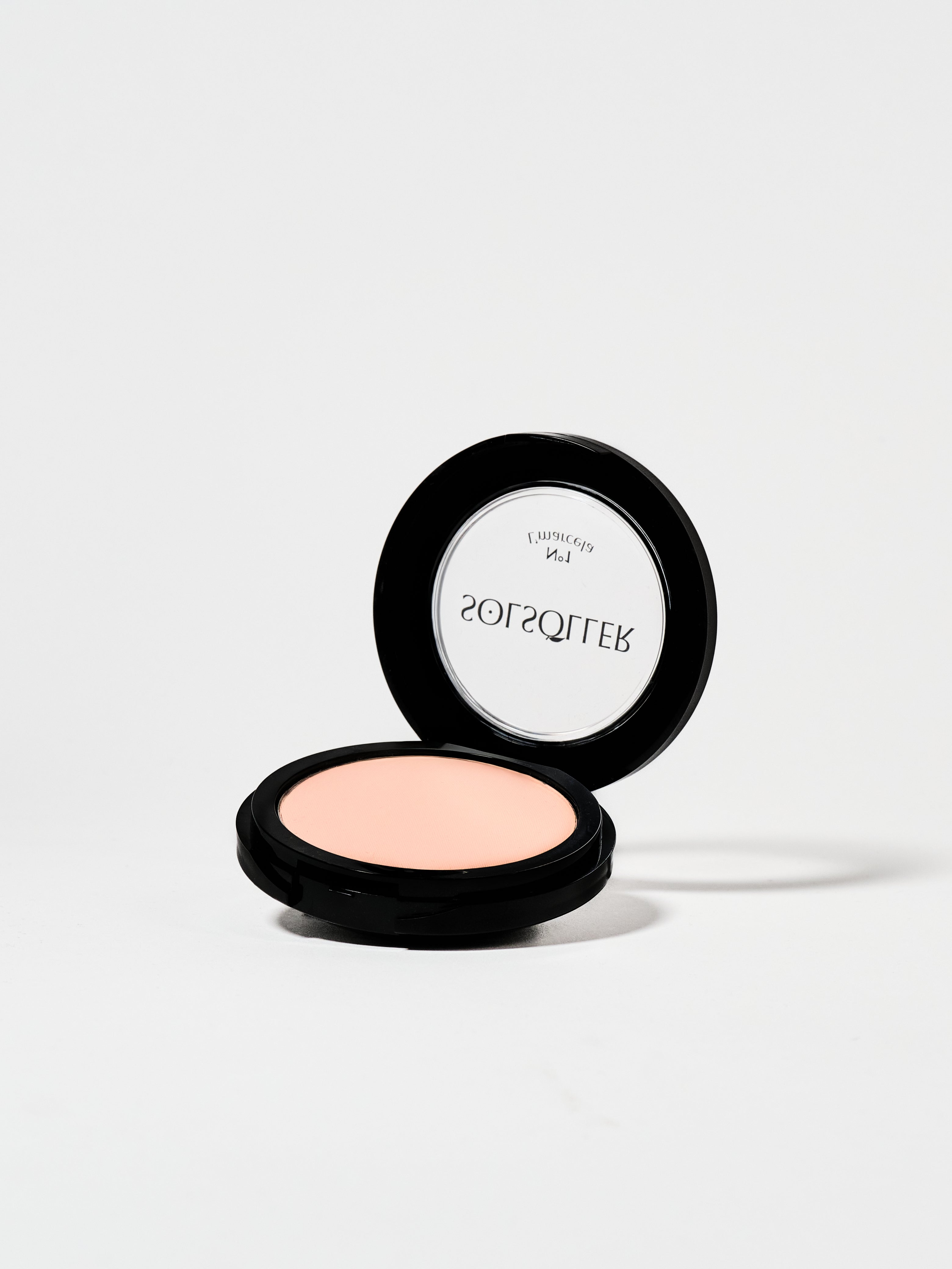 Open compact of L’Marcela Setting Powder revealing soft pink powder, perfect for setting makeup with a smooth, matte finish.