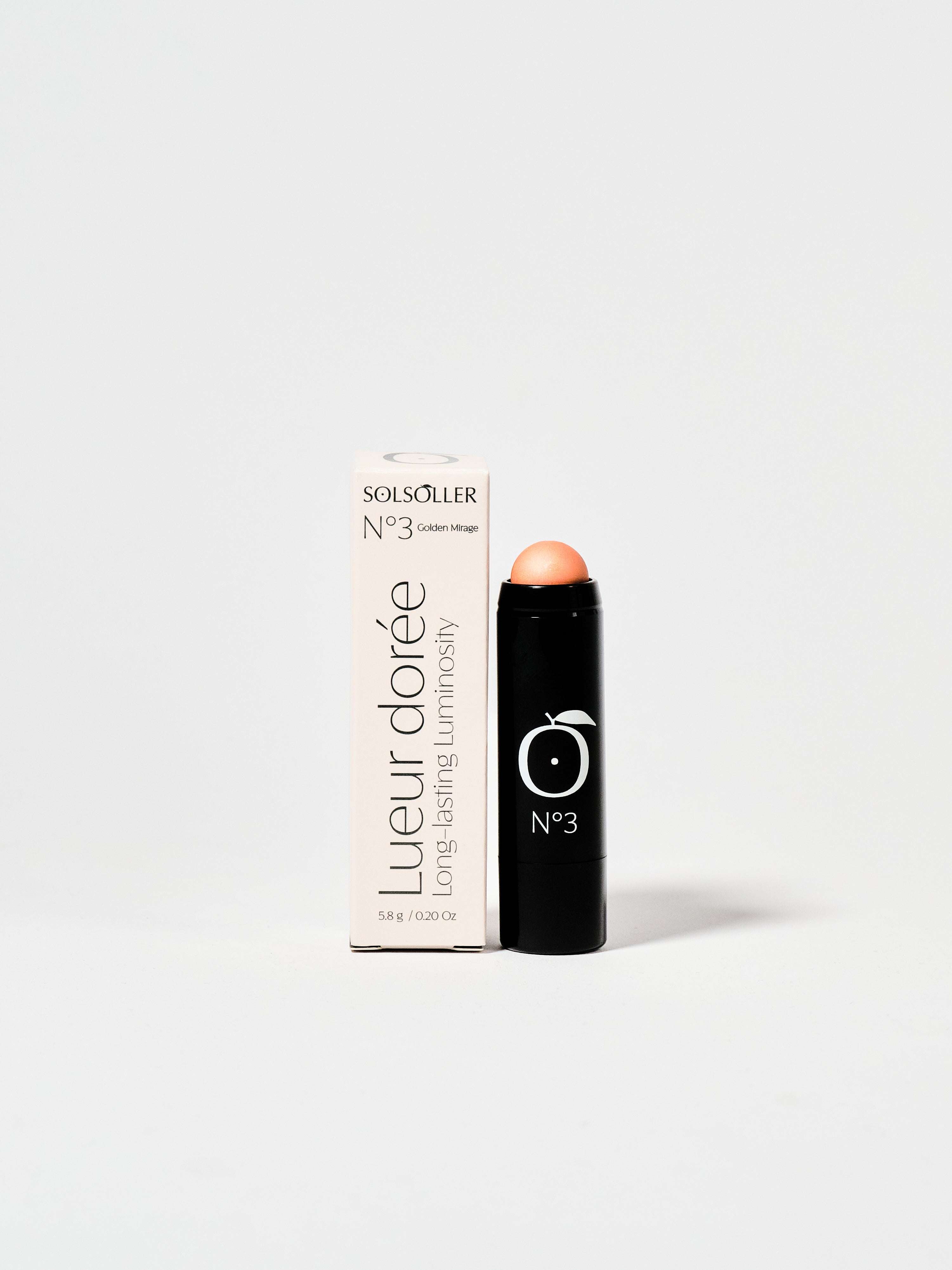 Golden Mirage - Coral Glow Highlighter No.3 stick with packaging, offering 13hr radiant wear for cheeks, lids, lips, and collarbone.