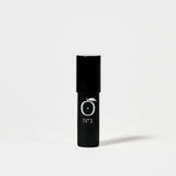 Aurora Glow Highlighter - Pink Pearlescent Glow by Rad in sleek black tube with No.3 label, ideal for on-the-go face makeup.