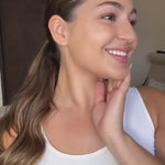 Smiling model with glowing skin wearing Teint Naturelle Foundation. Lightweight formula perfect for daily use.